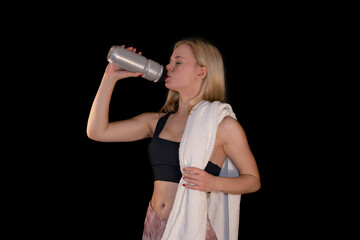 Young Girl Drinking Water After Workout with Towel
