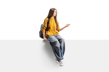 Teenage female student sitting on a panel and talking