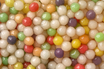 Colorful cooked tapioca pearls close up full frame as background