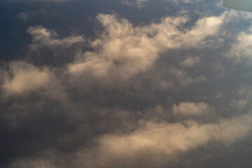 Dramatic clouds reflecting sunlight during late afternoon over an expansive sky