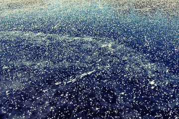 Glaciology. Young freshwater ice with characteristic tabular crystals of perspiration on the surface (crystal flake). Nilas at the age of 2 days, temperature. The most beautiful pattern