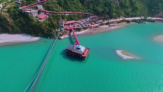 Drone captures Dhari Devi Temple amidst breathtaking Himalayan rivers and greenery.