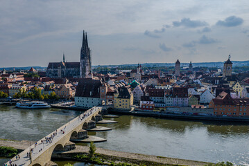Obraz premium Beautiful aerial view of Regenesburg, its massive gothic St Peter cathedral, the Danube river and the Old Stone Bridge