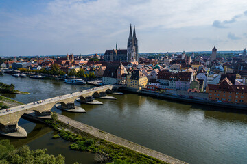 Naklejka premium Beautiful aerial view of Regenesburg, its massive gothic St Peter cathedral, the Danube river and the Old Stone Bridge
