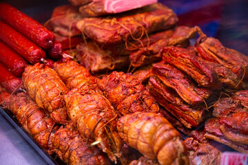 Showcase window of diverse meat production in a butcher shop. Meats sale department in the hypermarket.