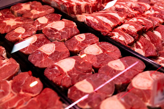 Raw beef meat osso buco shank steak lower part of cows foreleg. Red meat selection in butchers shop, fresh beef osso.