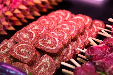 Row beef roll and meat arrangment either for grill or barbeque. Food industry meat for sale.