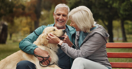 Dog, outdoor and old couple on bench, smile and conversation with animal lover. Park, pet and happy senior man with old woman, bonding together and relationship with break, relax and retirement