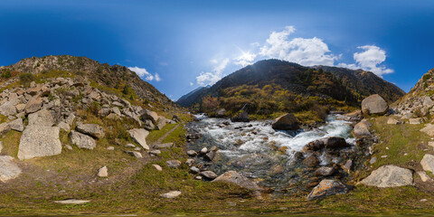 Full Spherical panorama of narrow seething mountain river bank on a sunny autumn day in picturesque remote valley in equirectangular projection