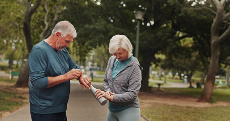 Senior, couple and check watch with fitness outdoor for running speed, monitor health and progress...