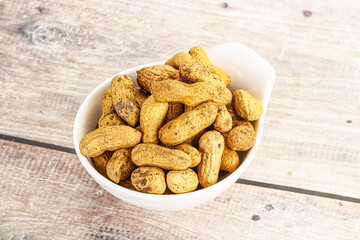 Raw ripe unpeeled peanut heap