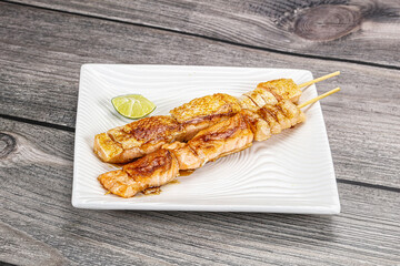 Grilled salmon skewer with sauce