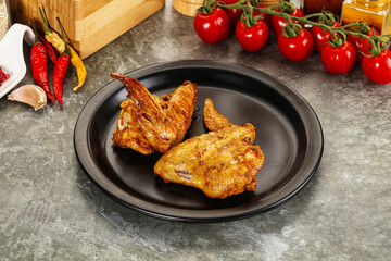 Tasty roasted chicken wing with spices