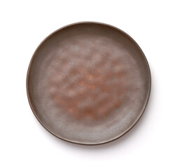 Top view of empty rough brown clay plate