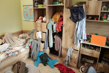 Scattered Things in Wardrobe, Disorder in Clothes. Childrens room is littered with clutter, clothes and things are scattered, Organizing Cleanliness