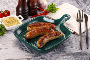 Delicous natural roasted sausages in the plate