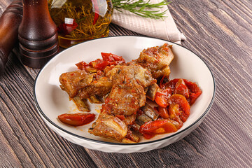 Baked lamb ribs with vegetables