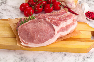 Raw potk loin steak with bone