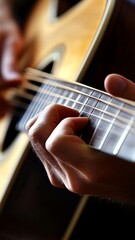 Fototapeta premium Strumming melodies a musician's hands intimate space photography warm lighting close-up artistic expression