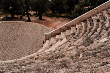 hellenistic antique amphitheatre Antiphellos on mediterranean coast, olive trees garden