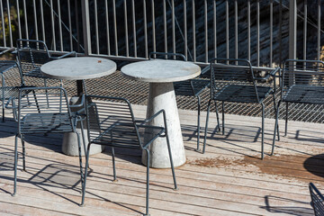 tables made of stone in an outdoor cafe
