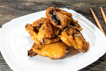 Fried eggplants with meat on a wooden background. Food concept. Chinese food.