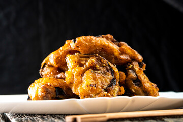Fried eggplants with meat on a wooden background. Food concept. Chinese food.