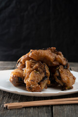 Fried eggplants with meat on a wooden background. Food concept. Chinese food.
