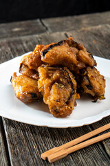 Fried eggplants with meat on a wooden background. Food concept. Chinese food.