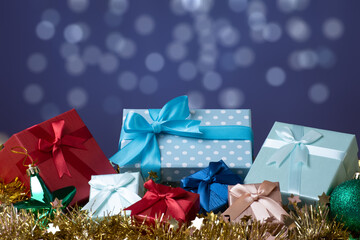 Gift boxes with Christmas decoration and copy space background with bokeh lights