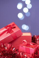 Open gift box with illuminated interior and bokeh lights with copy space