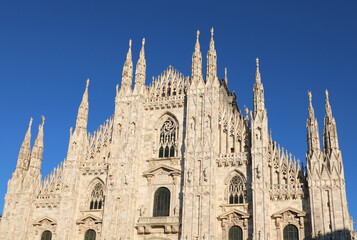 bottom view of Facade of Cathedral of Milan also called DUOMO DI MILANO in italian language in...