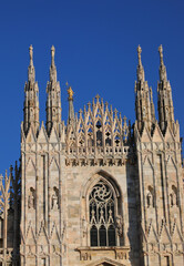 Detail Gothic facade of Cathedral of Milan in Italy called DUOMO DI MILANO