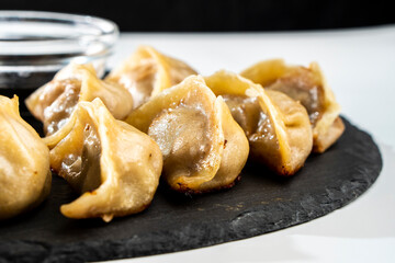 Dumplings with meat on a white background. Chinese dumplings are a traditional dish for Chinese New Year. Food concept. Chinese food.