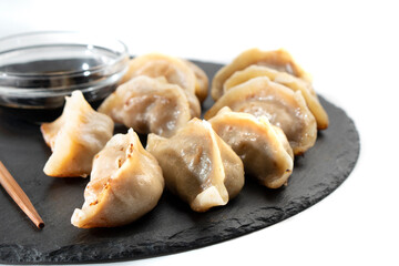 Dumplings with meat on a white background. Chinese dumplings are a traditional dish for Chinese New Year. Food concept. Chinese food.