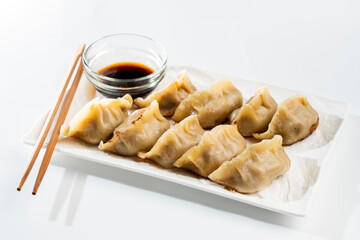 Dumplings with meat on a white background. Chinese dumplings are a traditional dish for Chinese New Year. Food concept. Chinese food.
