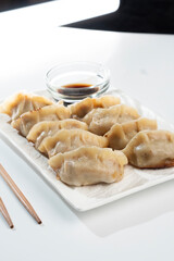 Dumplings with meat on a white background. Chinese dumplings are a traditional dish for Chinese New Year. Food concept. Chinese food.