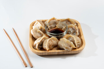 Dumplings with meat on a white background. Chinese dumplings are a traditional dish for Chinese New Year. Food concept. Chinese food.