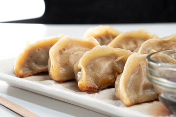 Dumplings with meat on a white background. Chinese dumplings are a traditional dish for Chinese New Year. Food concept. Chinese food.