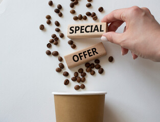 Special offer symbol. Concept word Special offer on wooden blocks. Businessman hand. Beautiful...