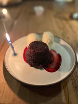 gluten free chocolate cake with  dairy free icr cream and birthday candle