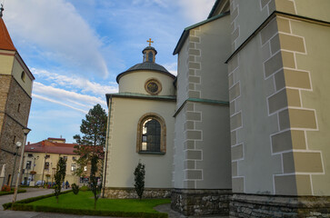 Cathedral of the Nativity of the Blessed Virgin Mary in Żywiec – a temple built in the fifteenth century with a high tower with a clock on it © Pawel Filusz