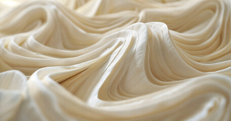 Obraz premium Layers of cream coloured paper or fabric in soft piles