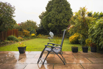 autumn rainy view of the garden near the house in England