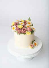 white cake with buttercream flowers