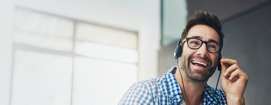 Banner, call center and smile with business man in office for consulting, customer service and agent. Contact us, help desk advisor and telemarketing with person in communication agency for advice