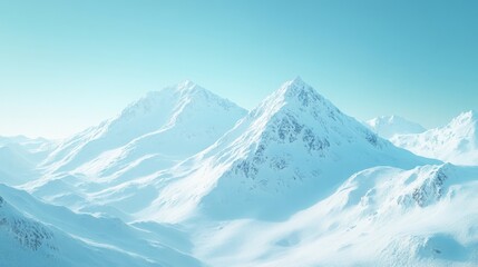 Obraz premium Serene Winter Mountain Range Under a Pale Blue Sky