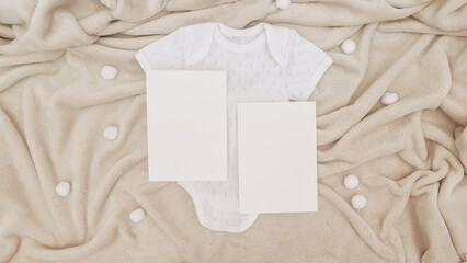 Cozy Baby Announcement Mockup with Blank Card, White Onesie, and Pastel Blanket – Ideal for Newborn Invitations and Family Celebration Designs