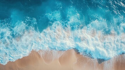 Ocean Waves Crashing on Sandy Beach: An Aerial View