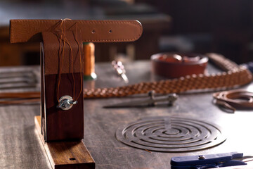 table with leather working tools and materials